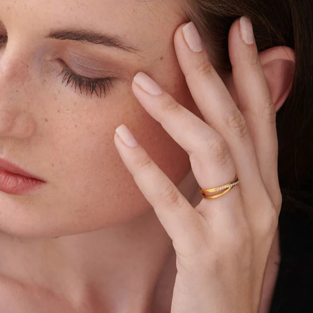 Cross-Over Stones Lined Twist Ring